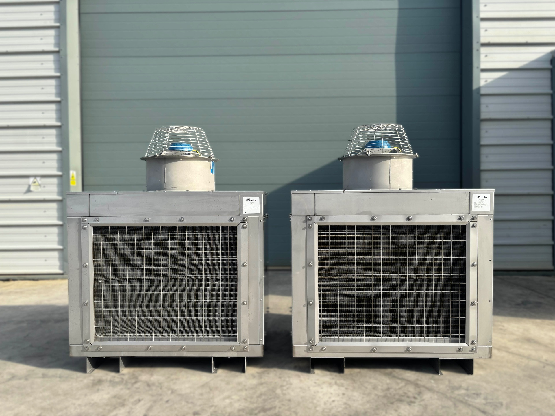 Pair of bespoke air cooled condenser units with protective fan guards