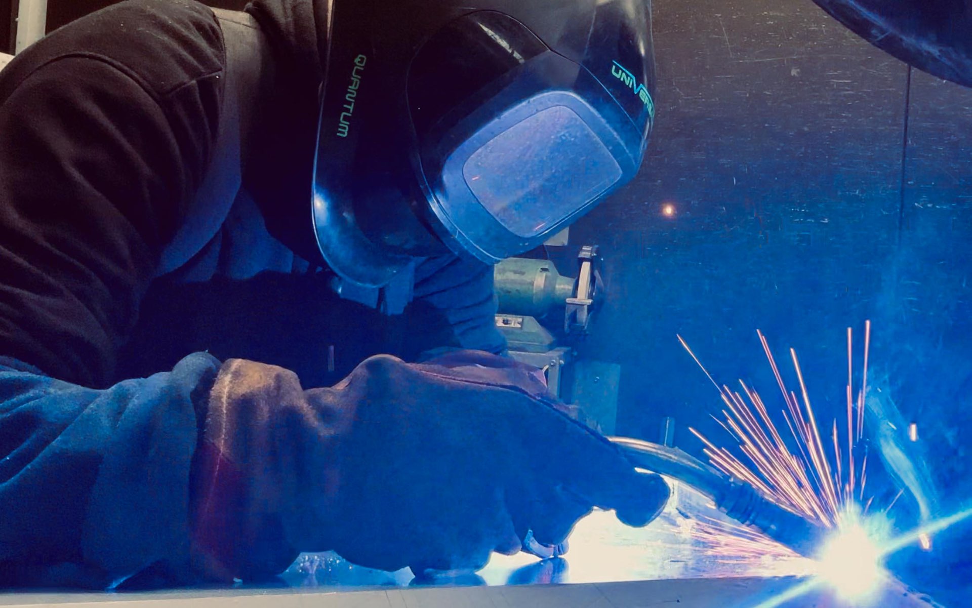 HC Coils technician welding in the workshop