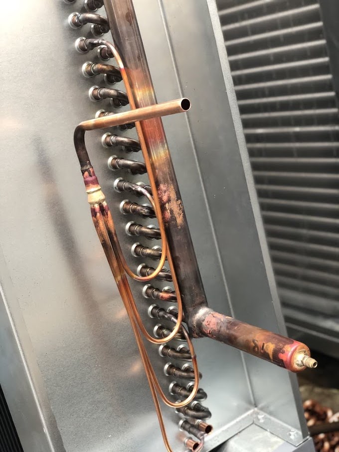 Copper return bend headers and distributor pipework brazed onto a heat exchange coil