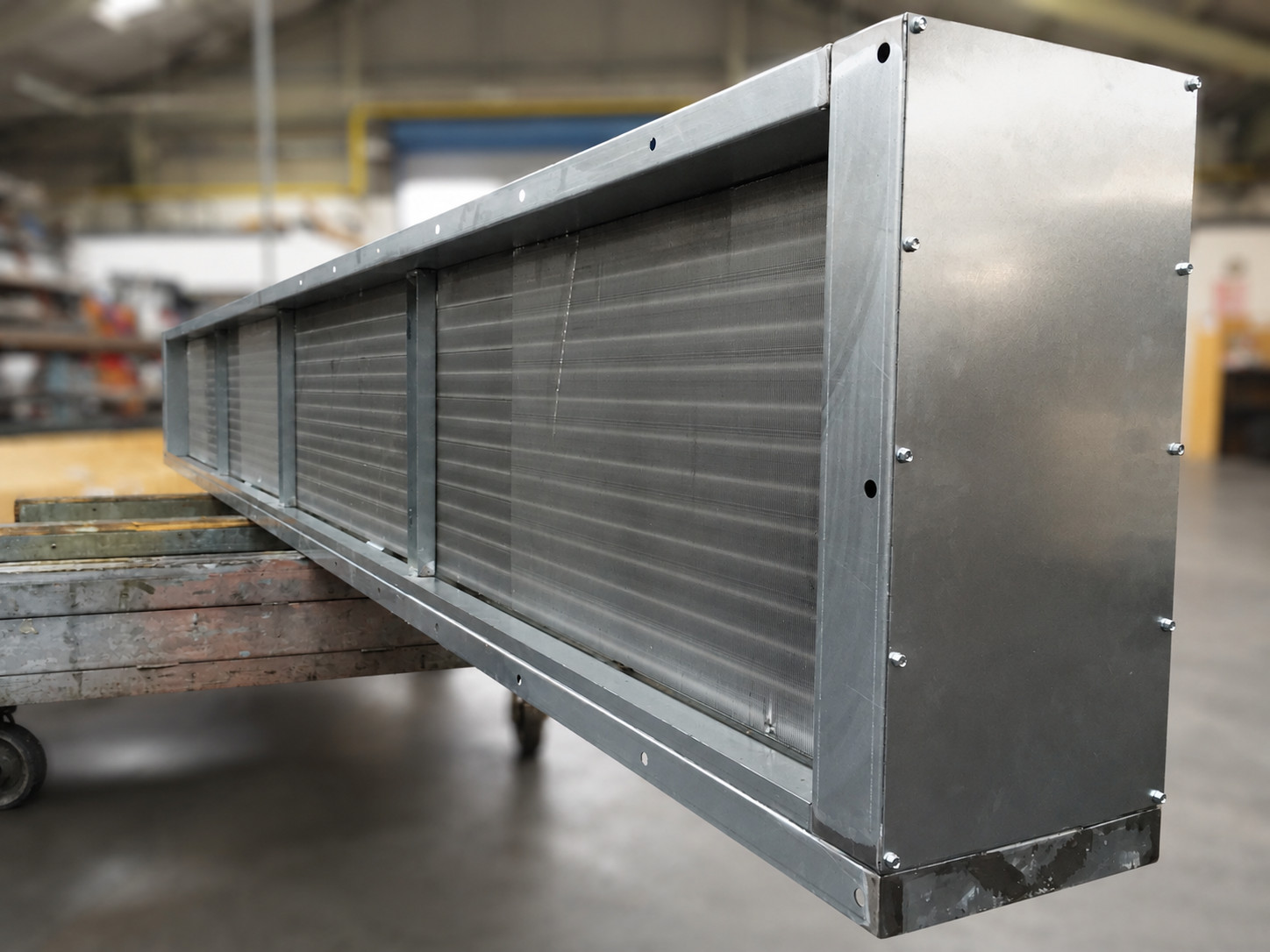 Long bespoke chilled water coil with galvanised casing in the HC Coils workshop