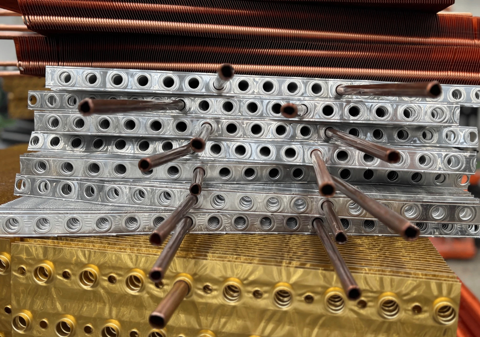 Aluminium and copper finned tube stack — bespoke HC Coils heat exchanger materials