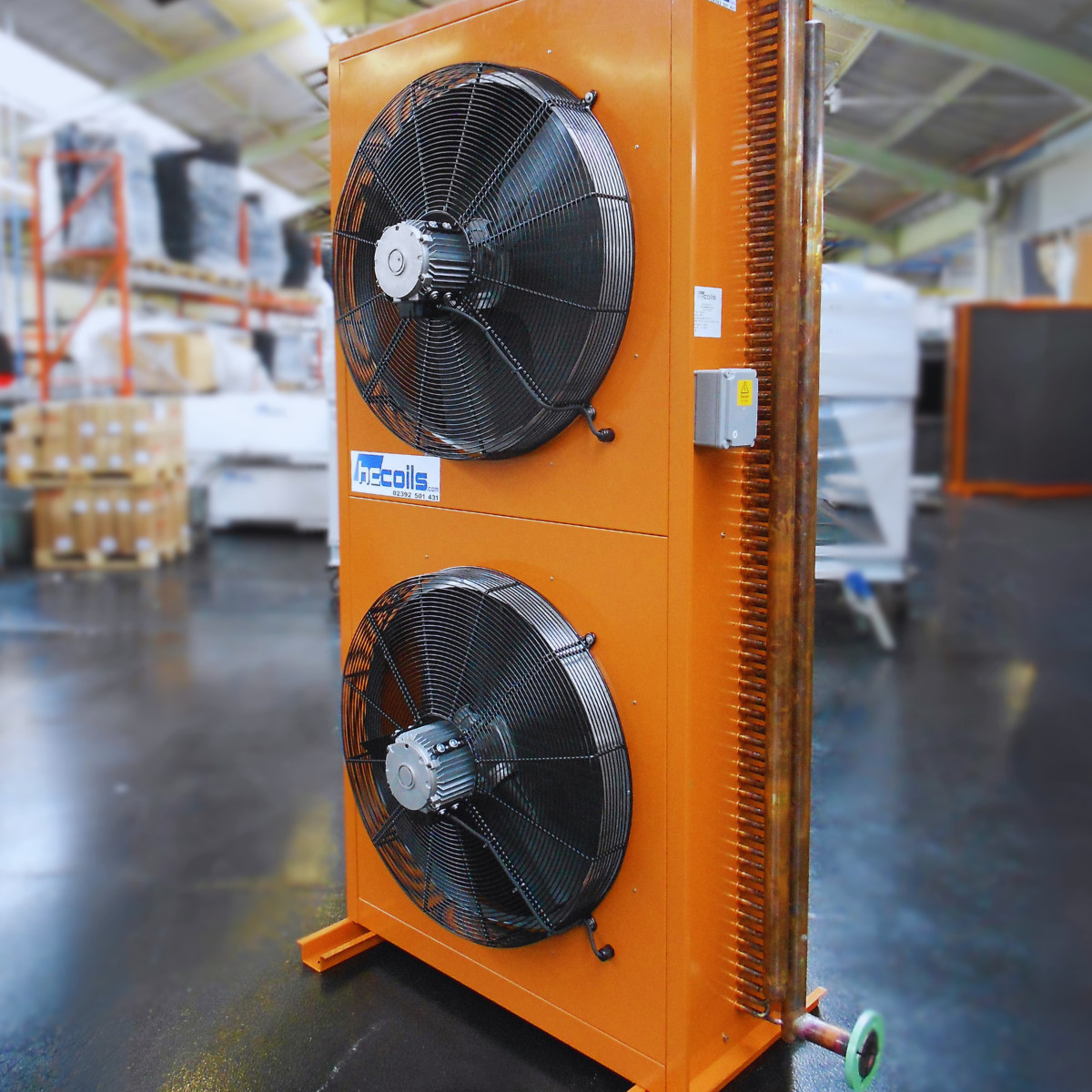 Orange-cased dry air cooler with twin axial fans and copper coil